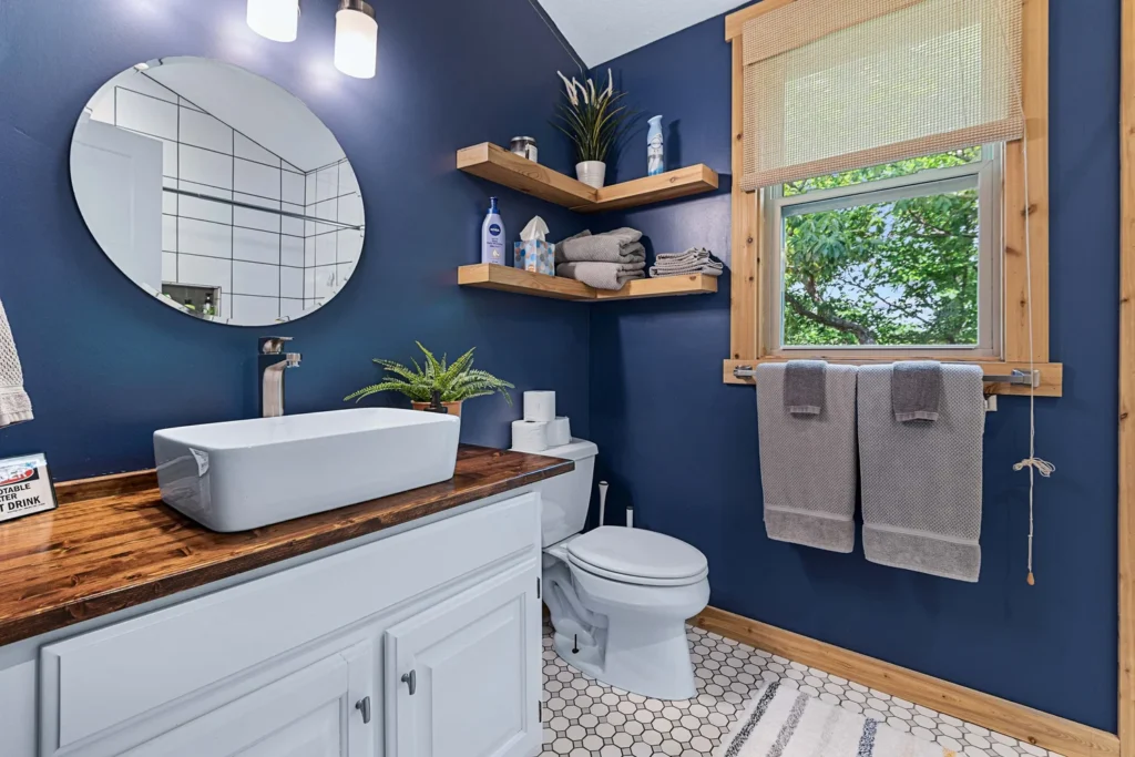 Clean and fresh bathroom remodel with blue wall.